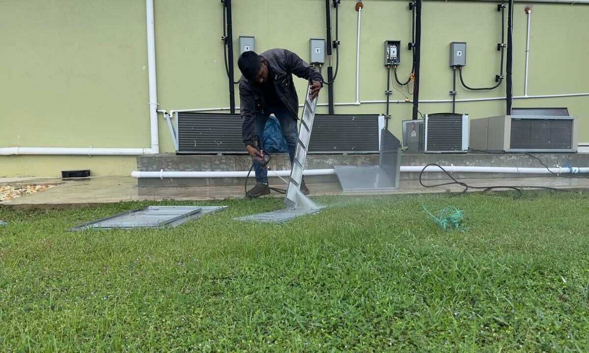 Pressure-washing a condenser coil