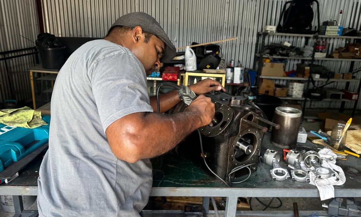 Rebuilding a compressor at the workshop bench
