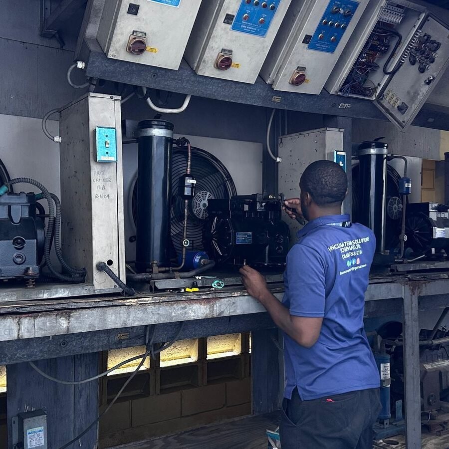 Checking a compressor under the bank of temperature controllers